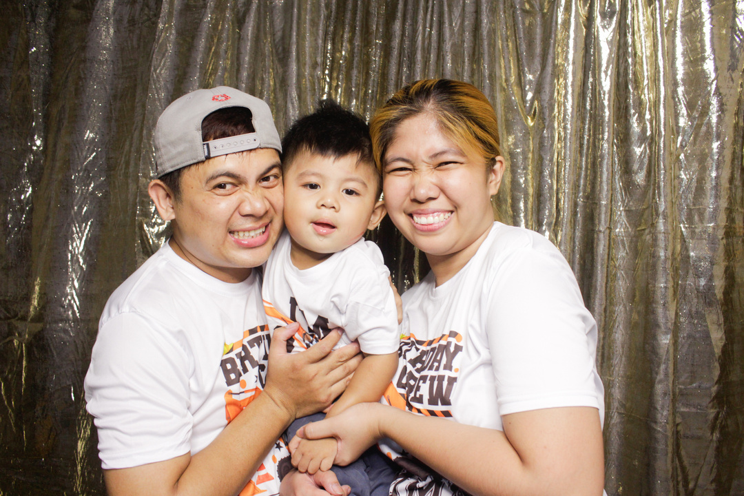 a family taking a photobooth image 